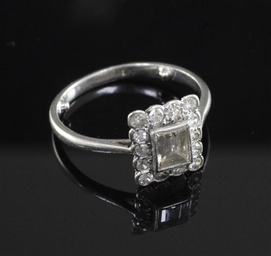 A mid 20th century platinum and diamond cluster ring, size M.
